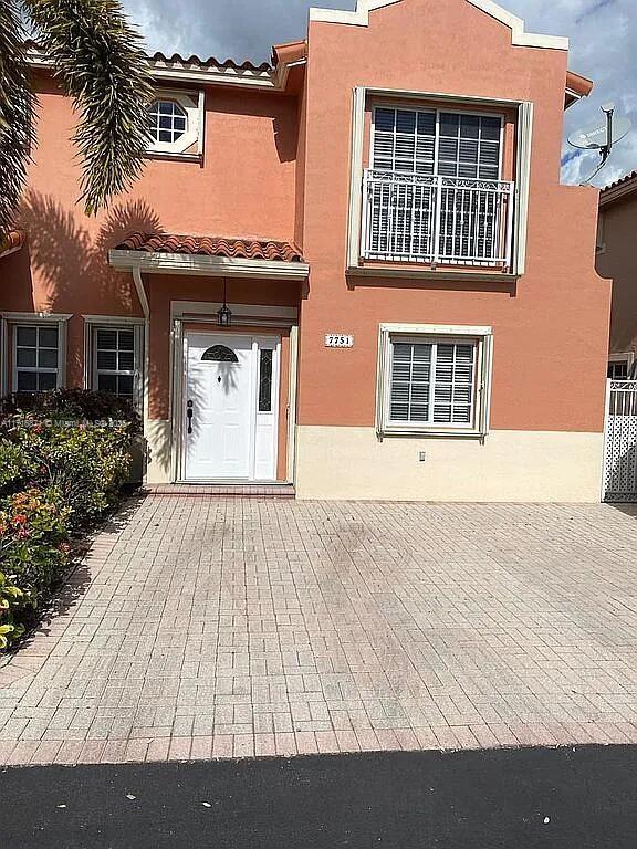 front view of a house with a dry yard