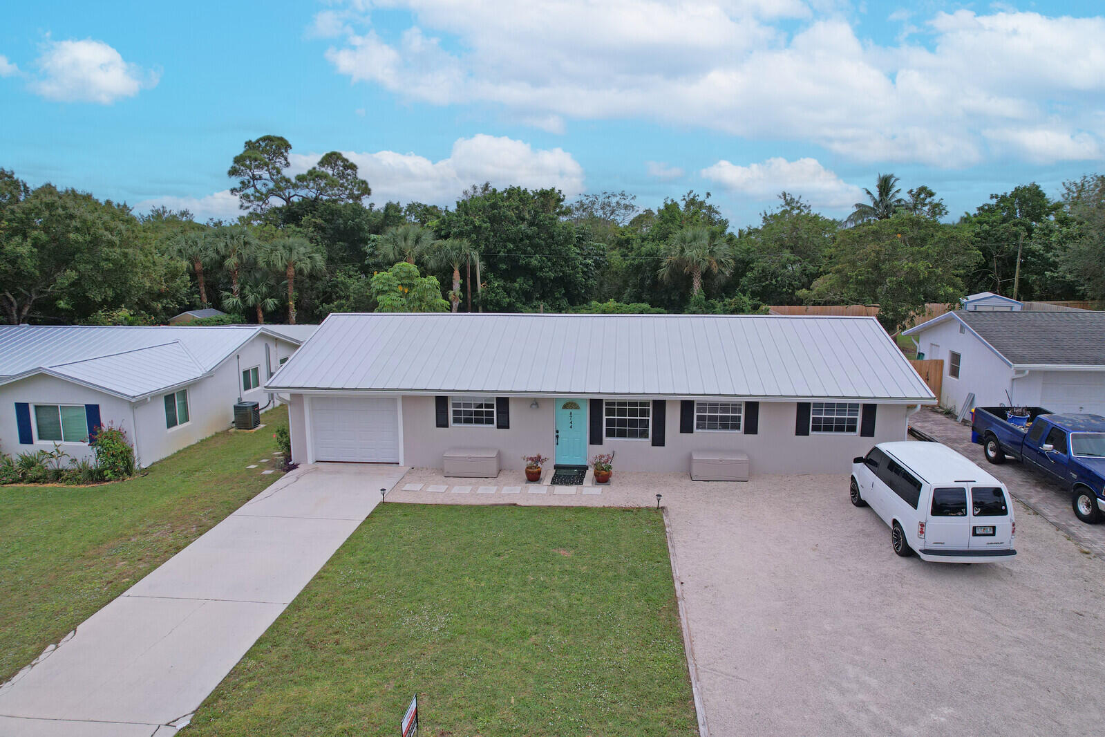 an aerial view of a house with table and chairs