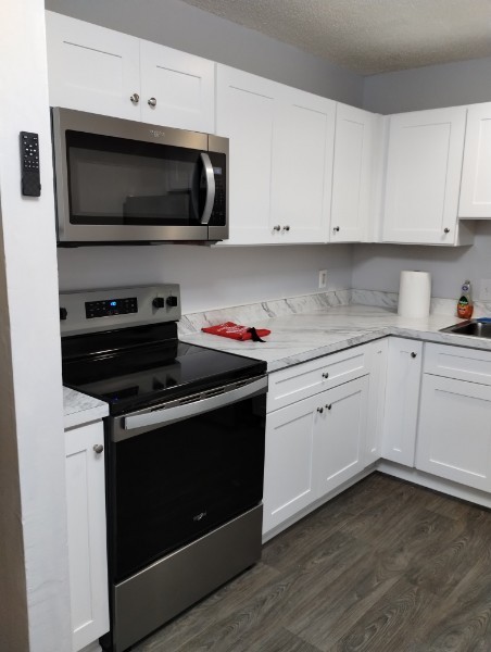 a kitchen with a stove and a microwave