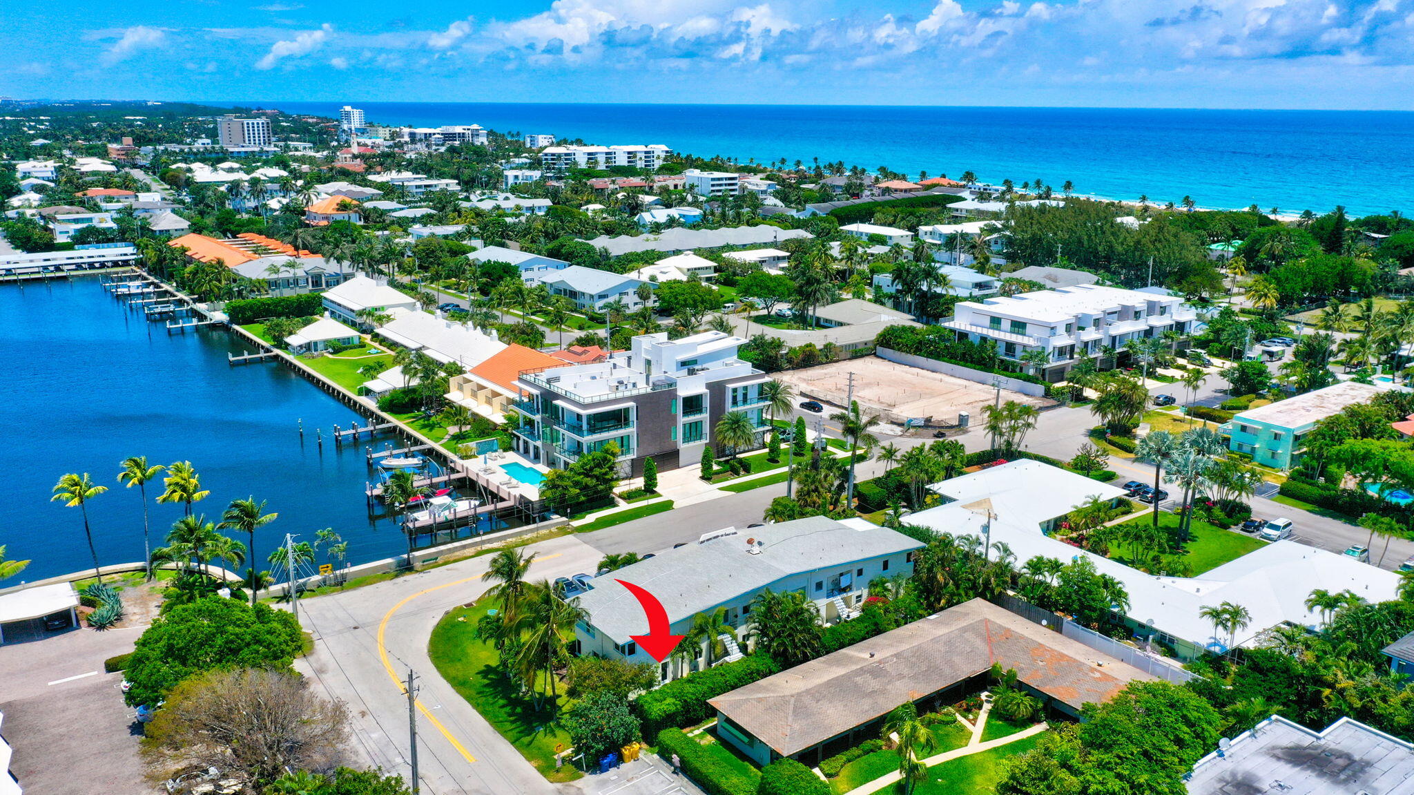 an aerial view of residential houses with outdoor space