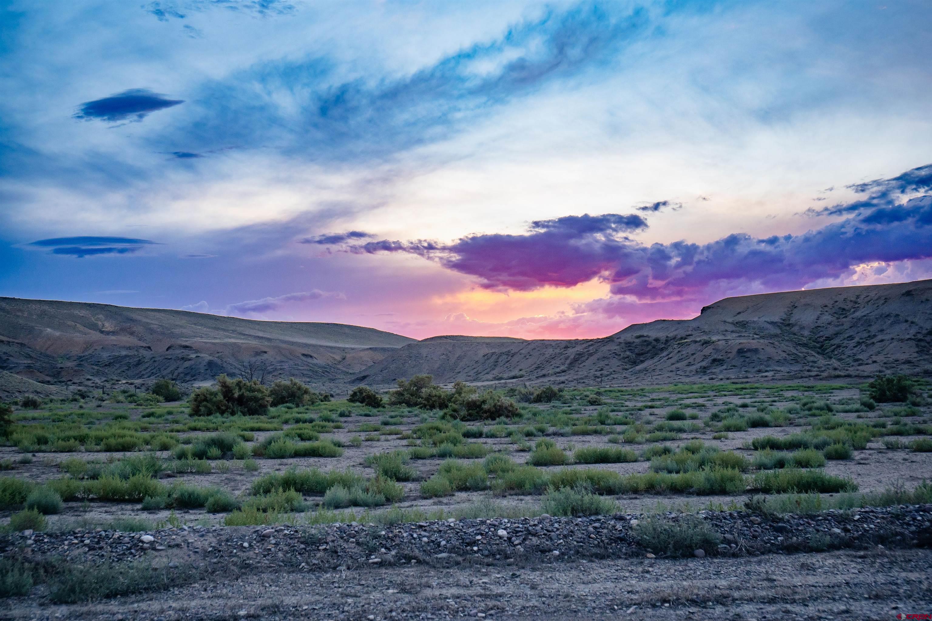 a view of sunset and mountains