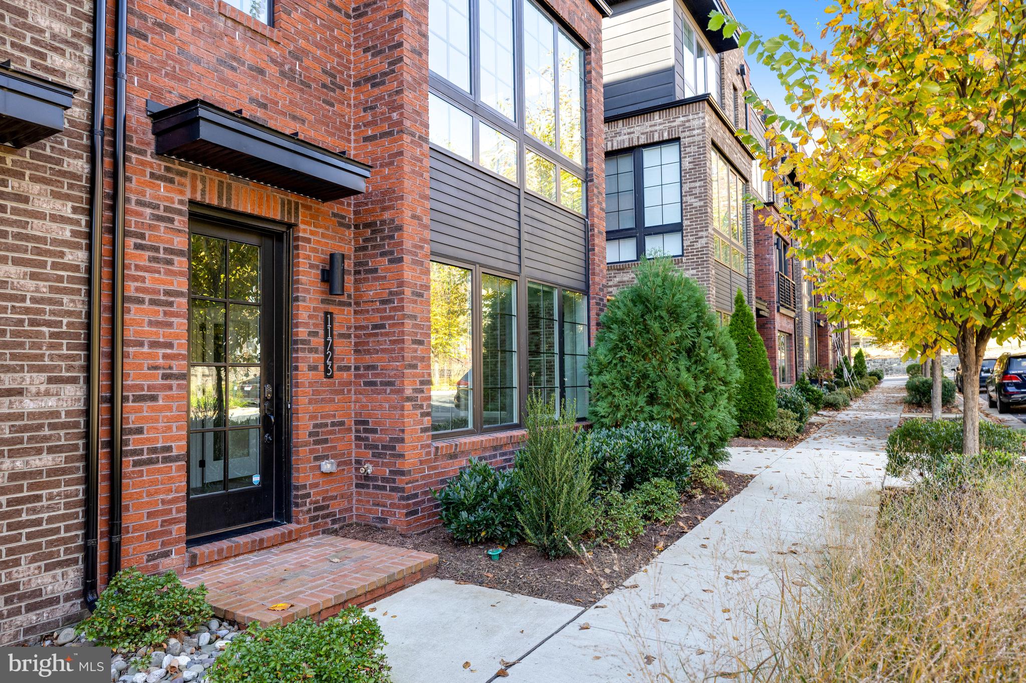 a view of a brick building with a yard