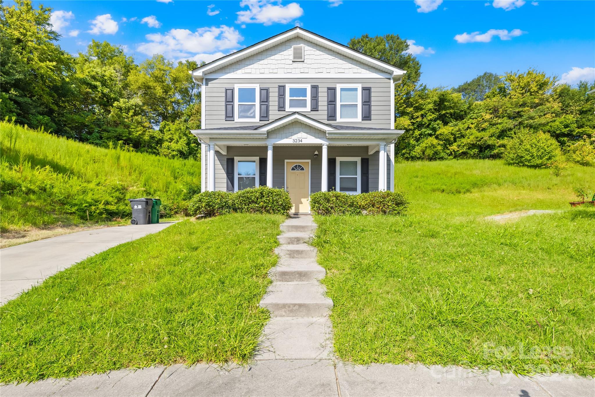 a front view of a house with yard