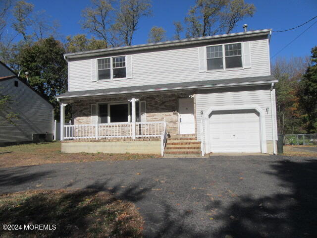 a front view of a house with a garage