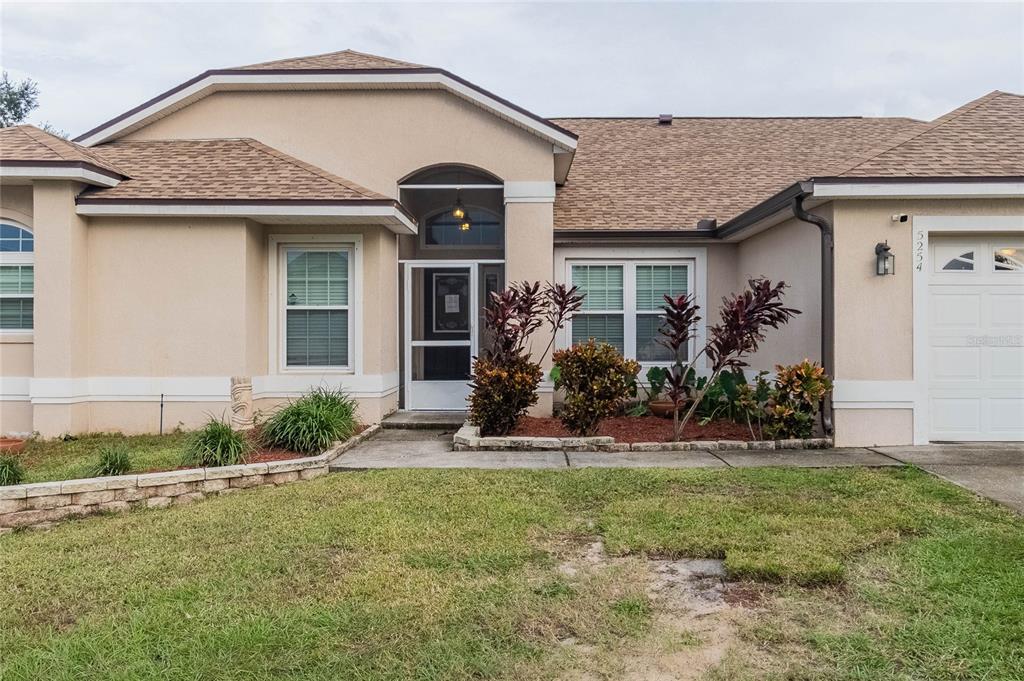 front view of a house with a yard