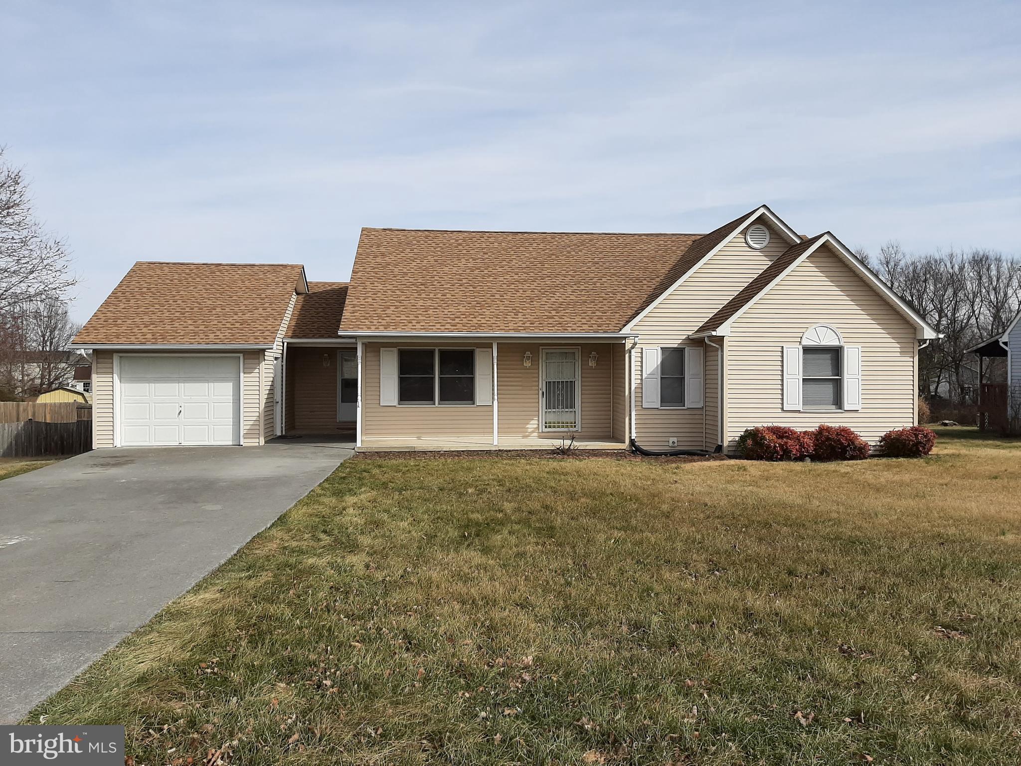 a view of a house with a yard and garage