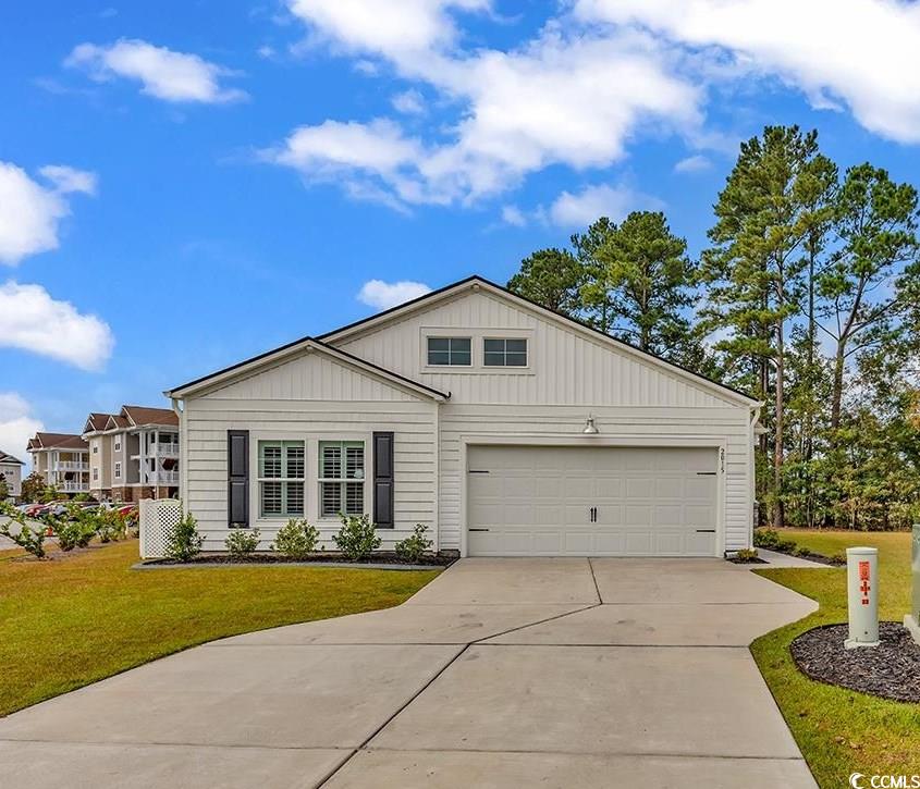 Exterior space featuring a garage, a porch, and a