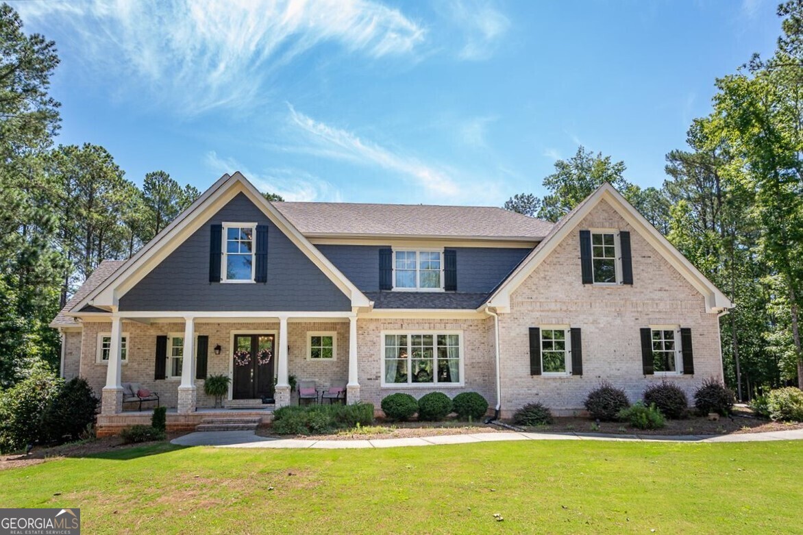 a front view of a house with a yard