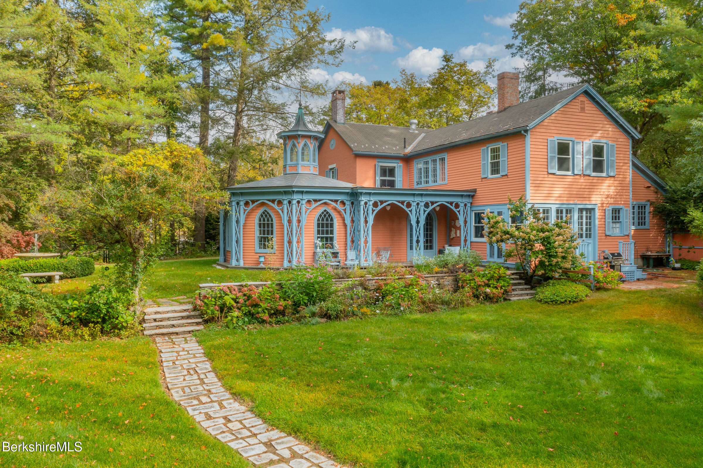 a front view of a house with garden