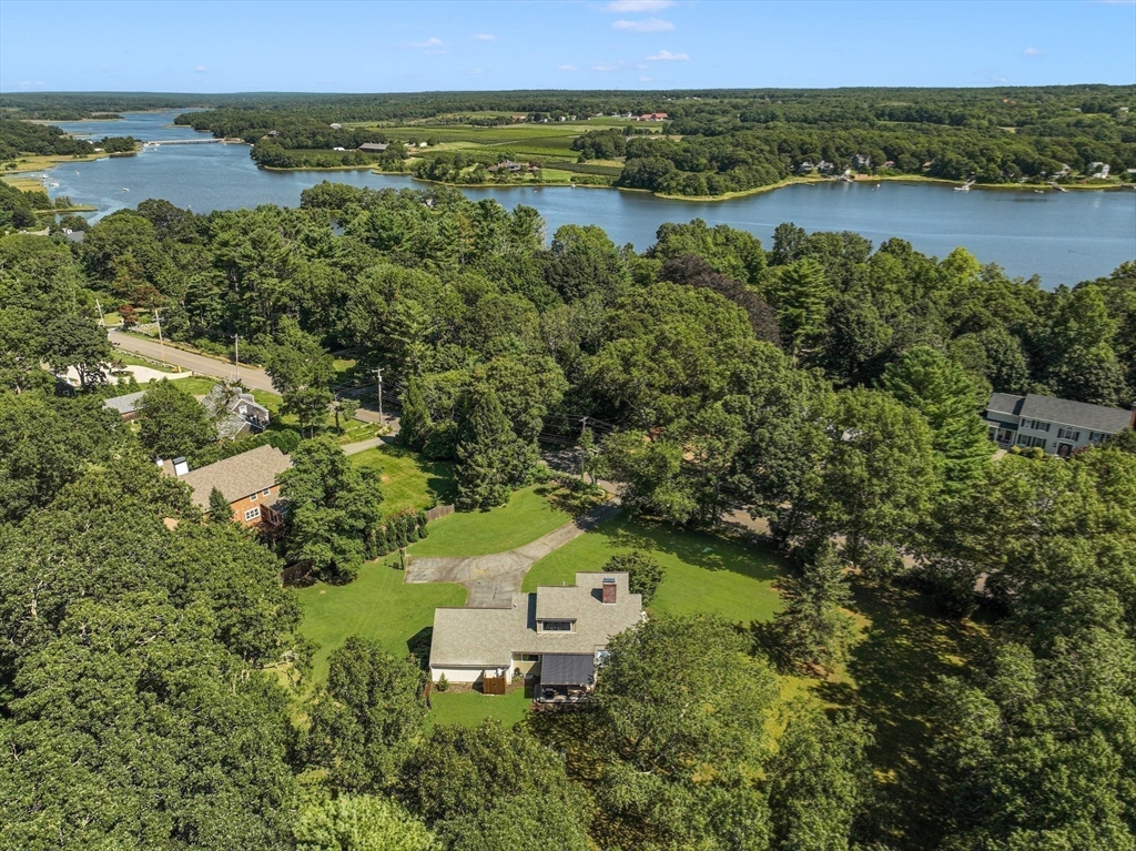 an aerial view of a house with a lake view