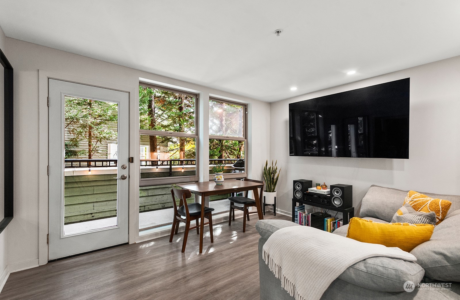 a living room with furniture and a flat screen tv