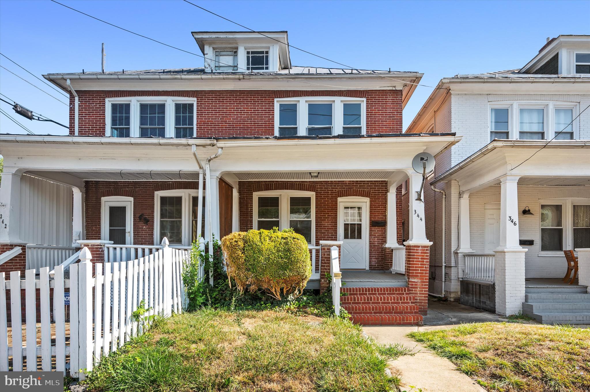 a front view of a house with a porch