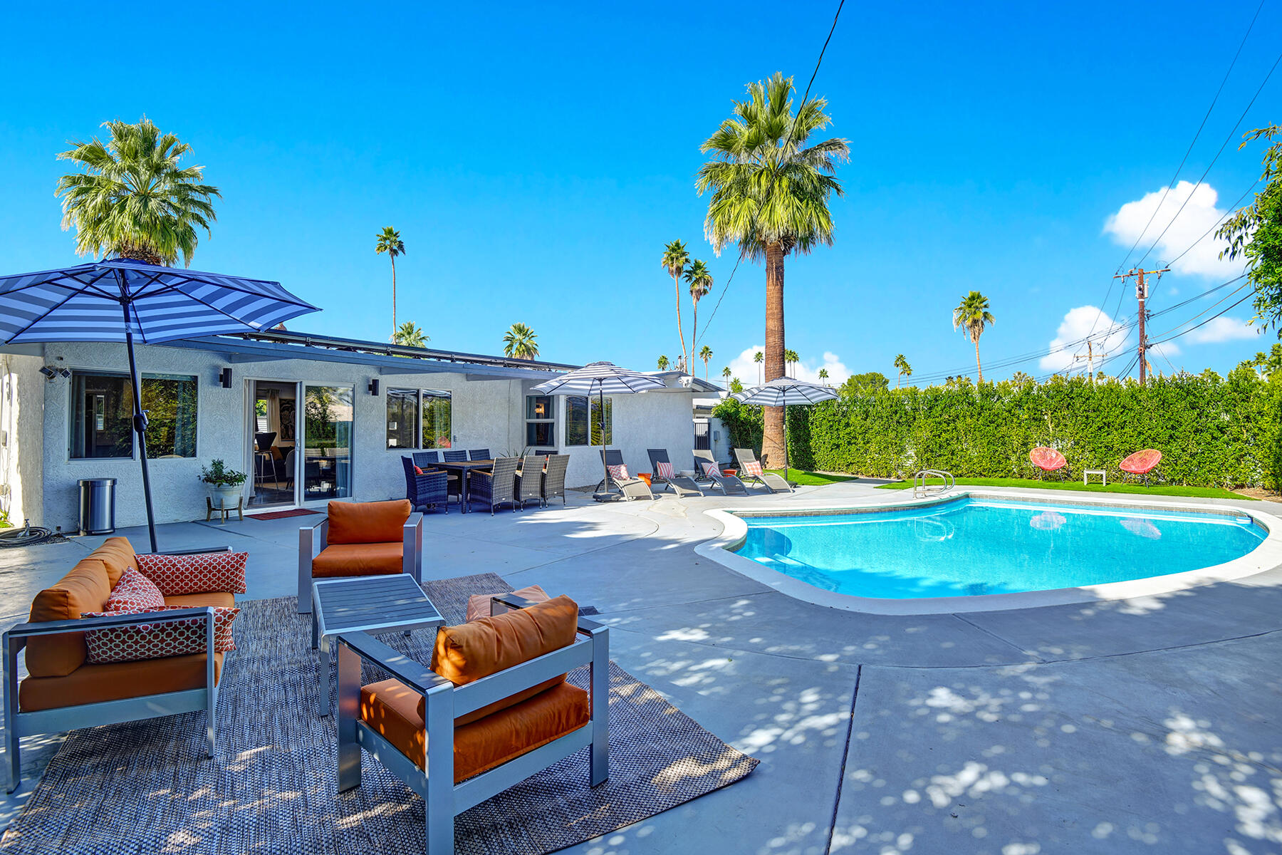 a swimming pool with outdoor seating yard and barbeque oven