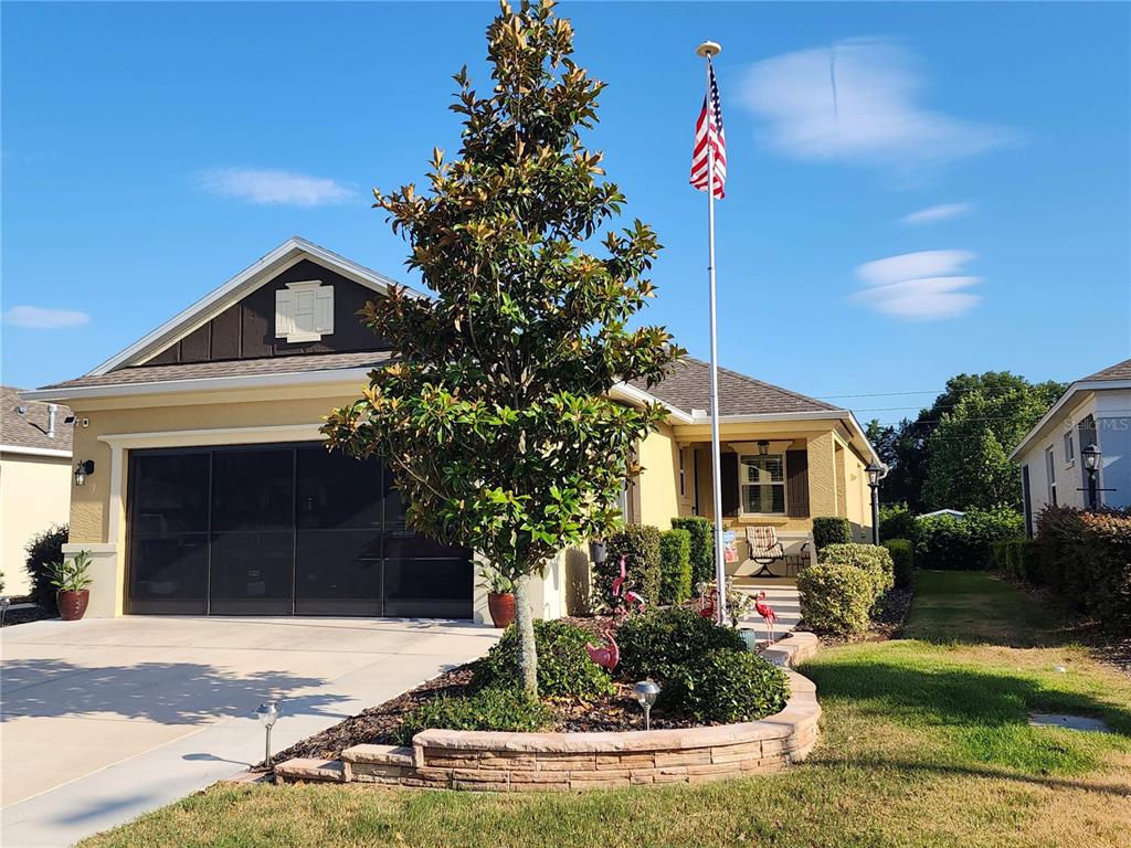 a front view of a house with garden