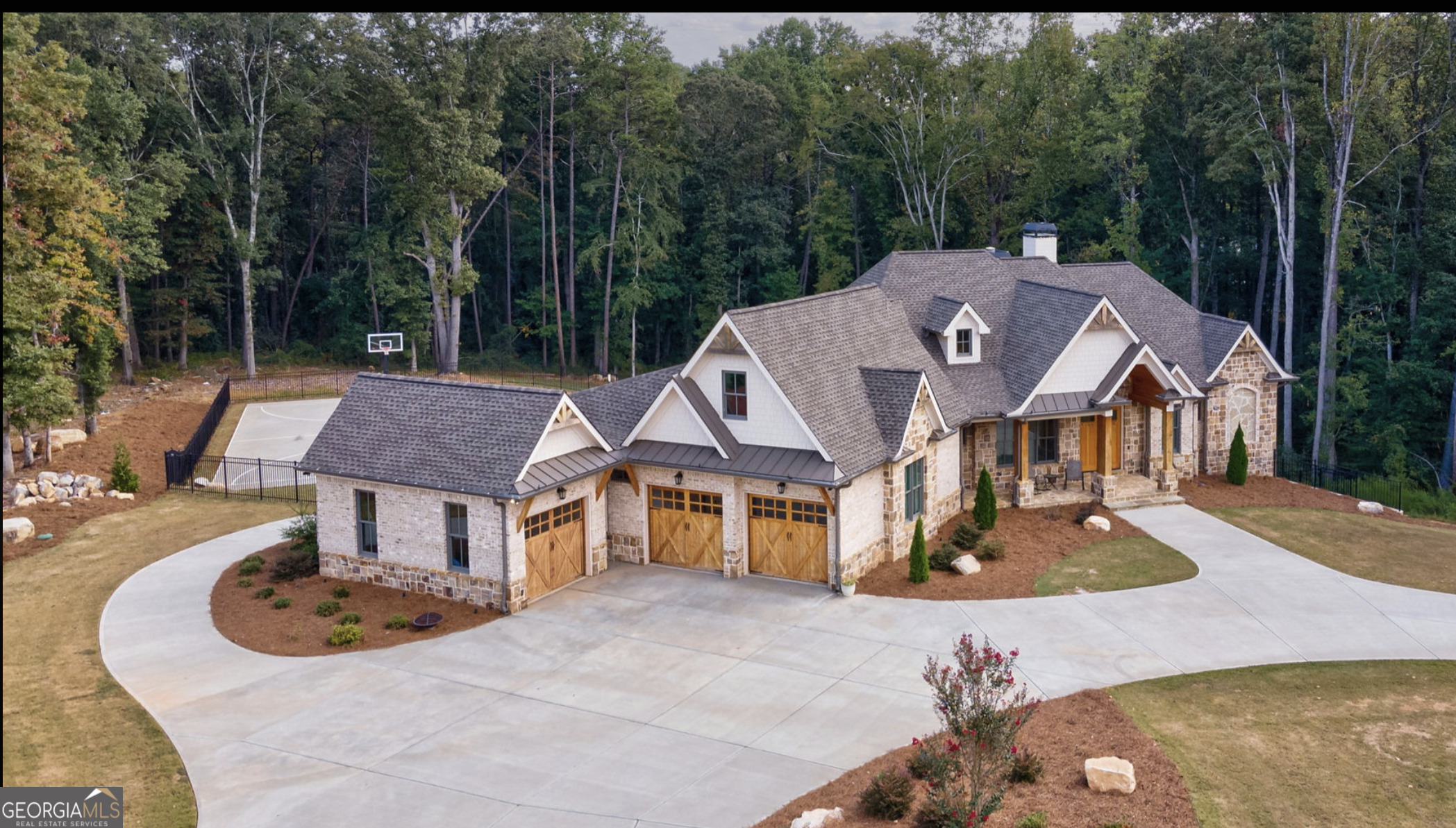 a aerial view of a house with swimming pool and deck