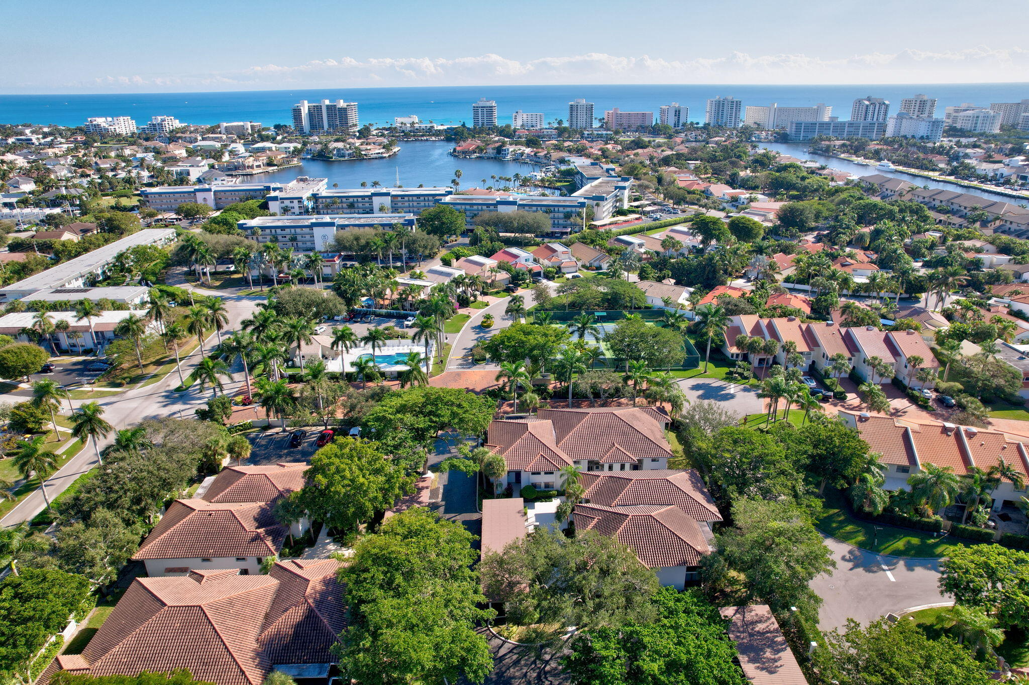 an aerial view of residential houses with outdoor space