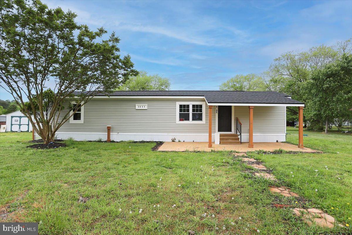 front view of a house with a yard