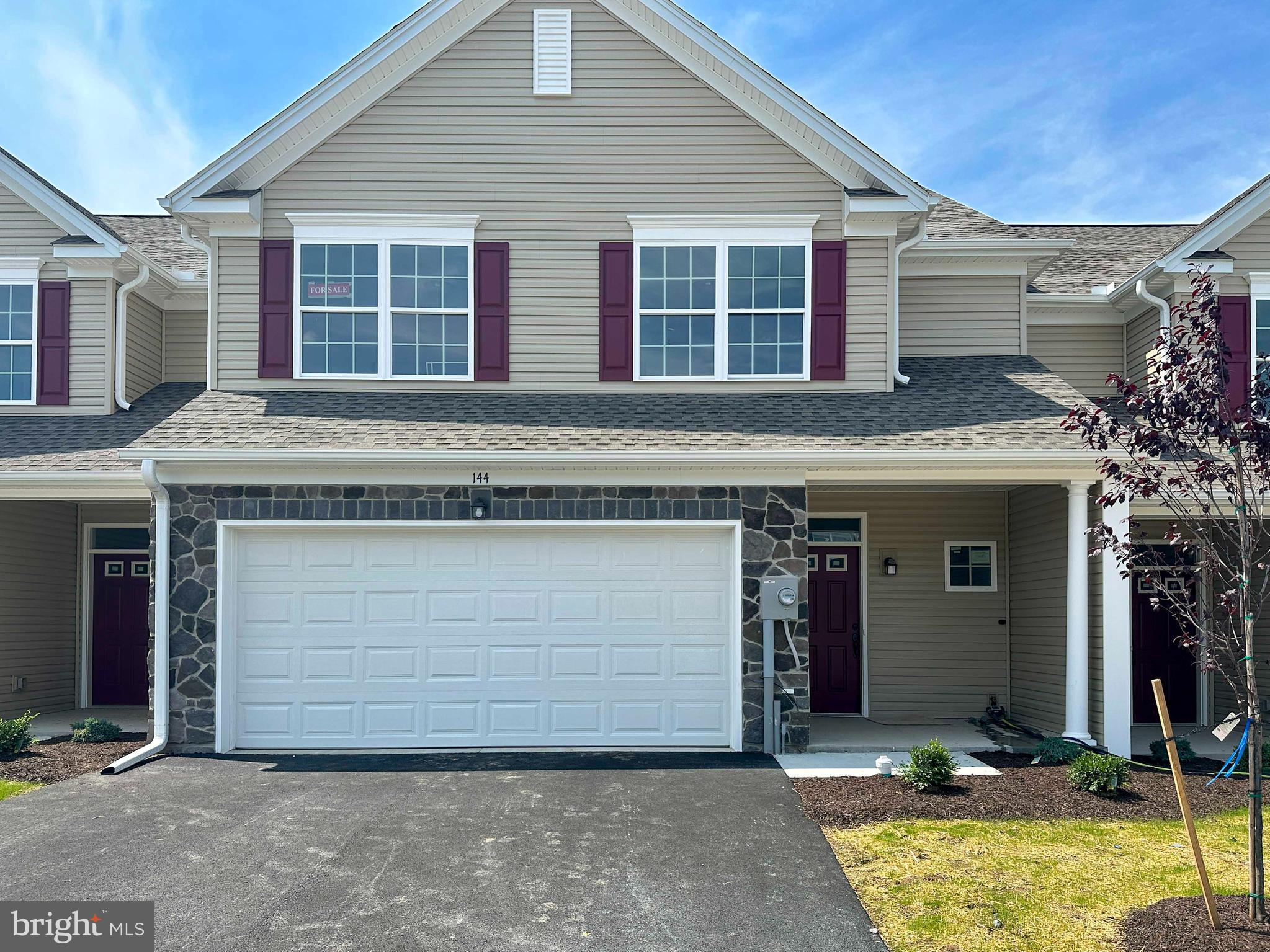 a front view of a house with a garage