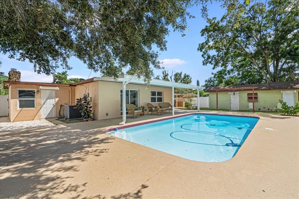 front view of a house with a swimming pool