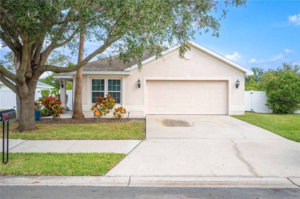 a view of a yard in front view of a house