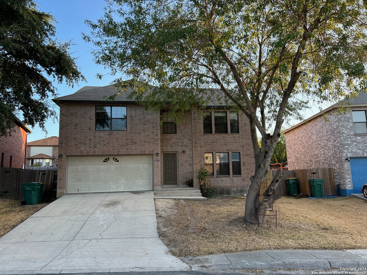 a front view of a house with a garage