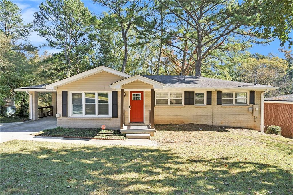 a front view of a house with a yard