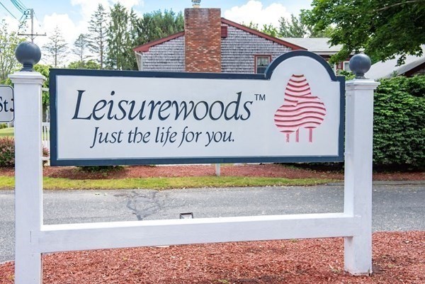 a view of a sign board with a outdoor space