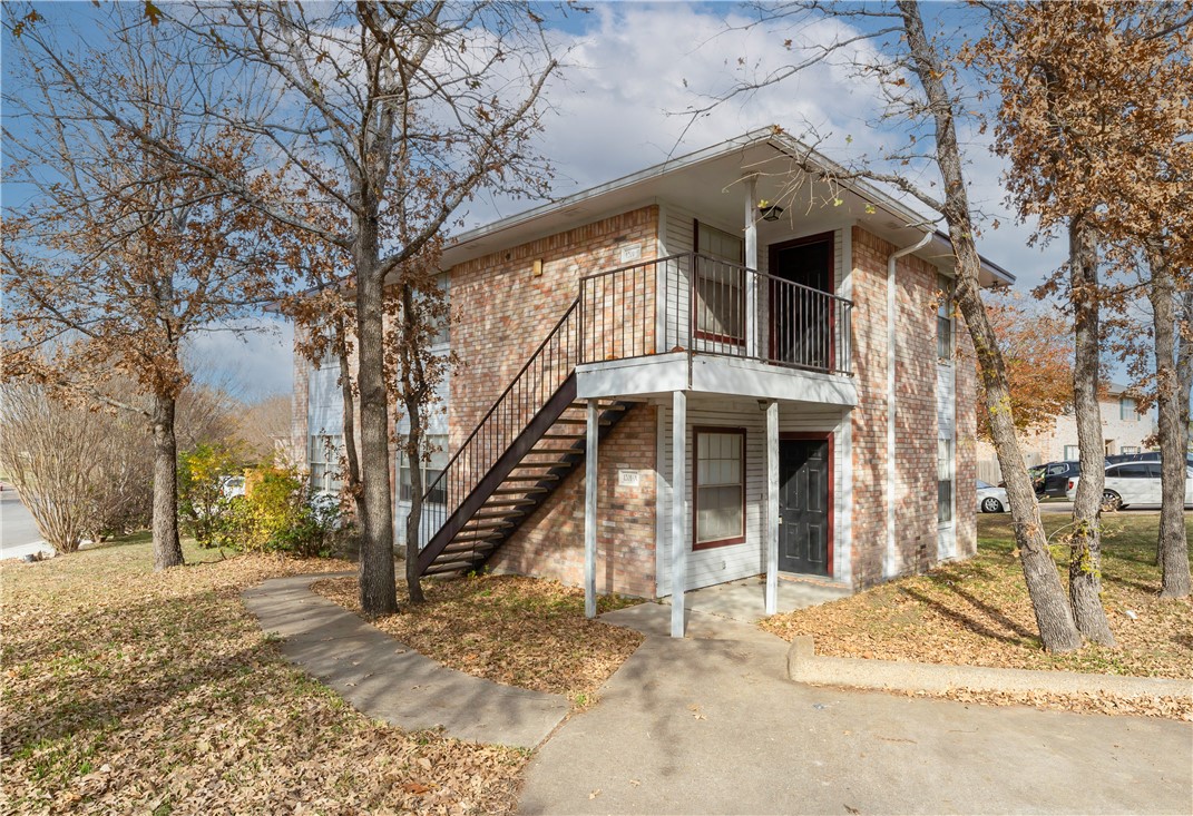 View of front of property featuring a balcony