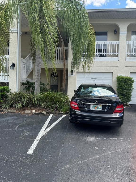 a car parked in front of a brick house