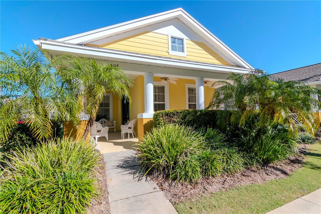 a front view of house with yard and outdoor seating