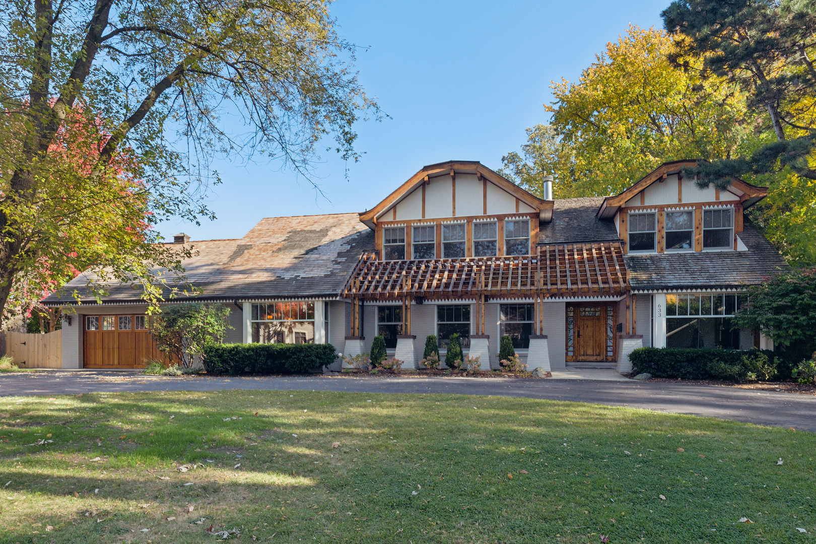 a front view of a house with a garden