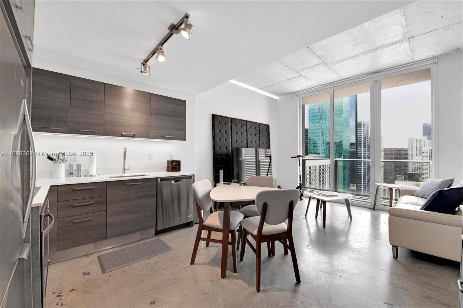 a view of a dining room with furniture window and outside view