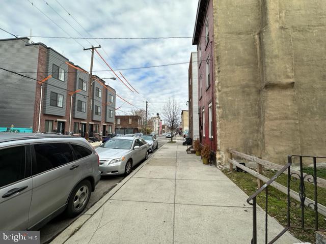 a view of a street with cars