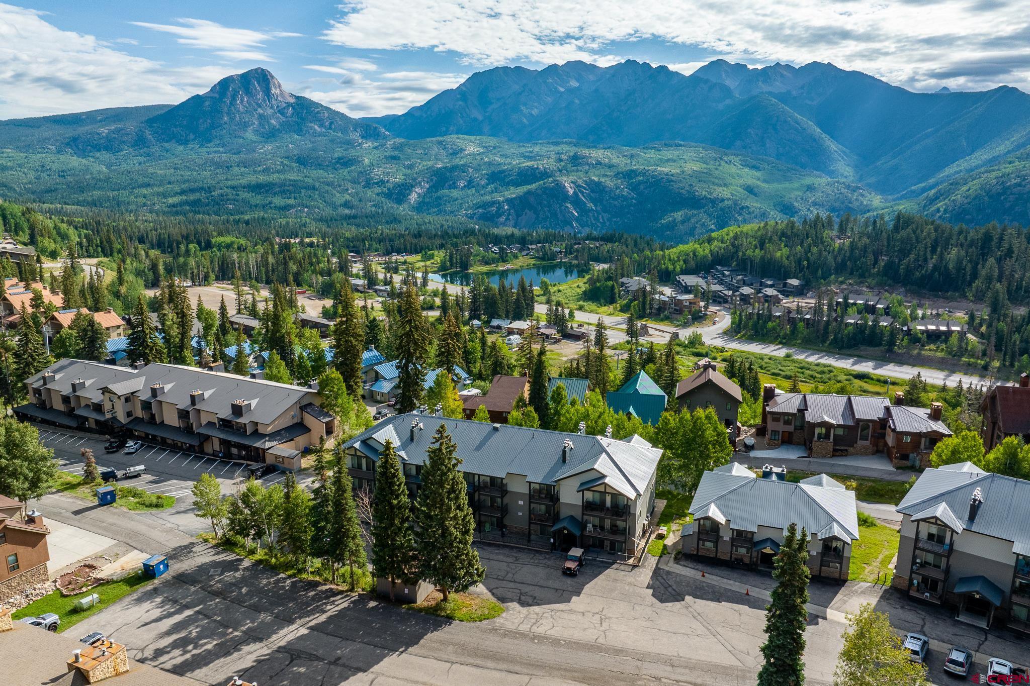 a view of multiple houses with outdoor space