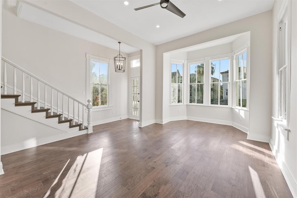 a view of an entryway with wooden floor and door