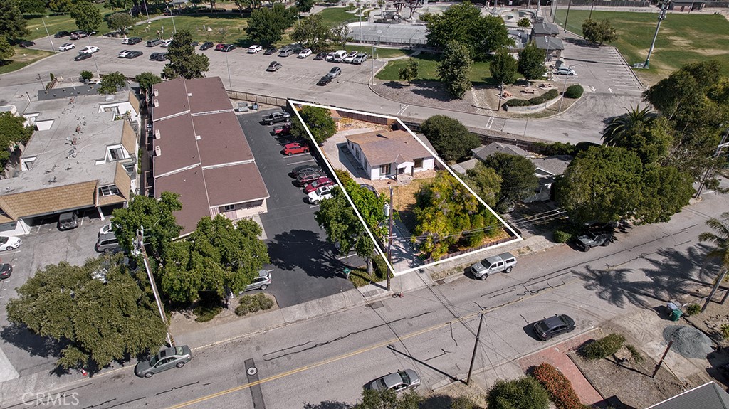 an aerial view of a house with outdoor space