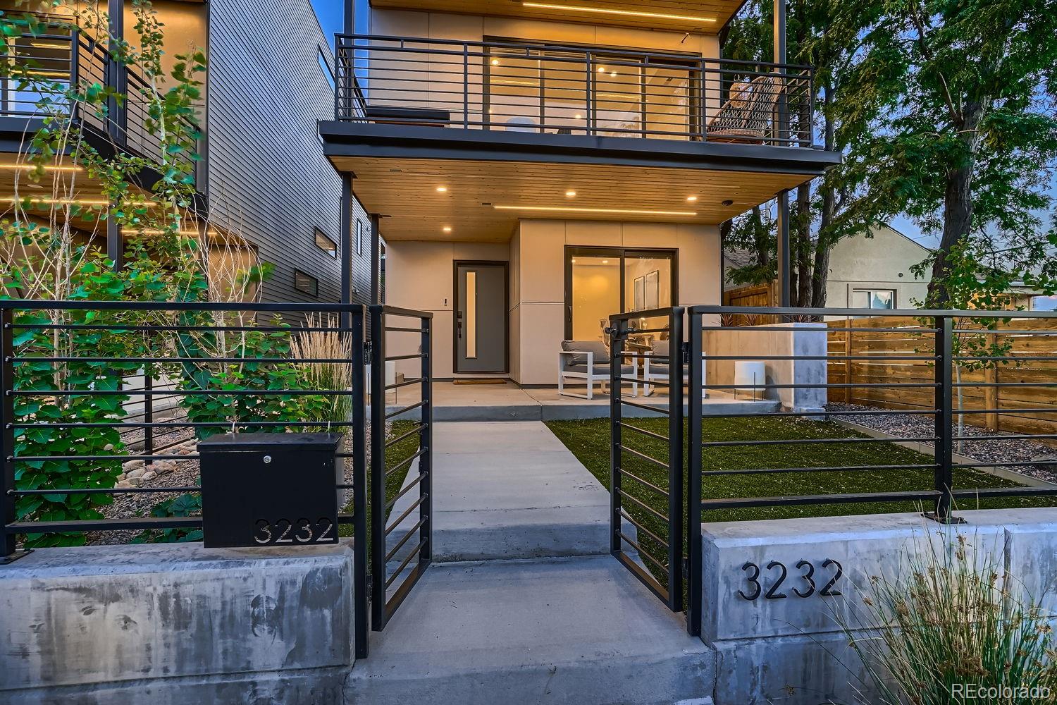 an outdoor view of a house with a balcony