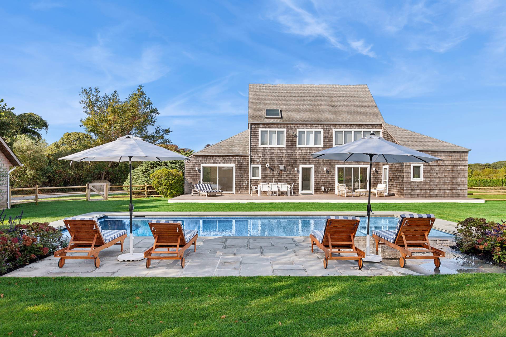 a view of a house with a yard porch and sitting area