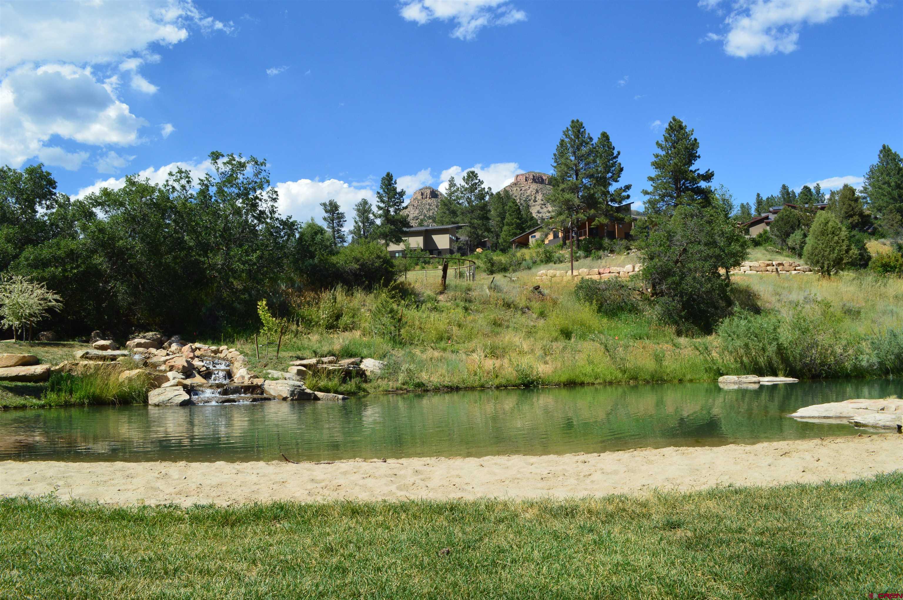 a view of lake with green space