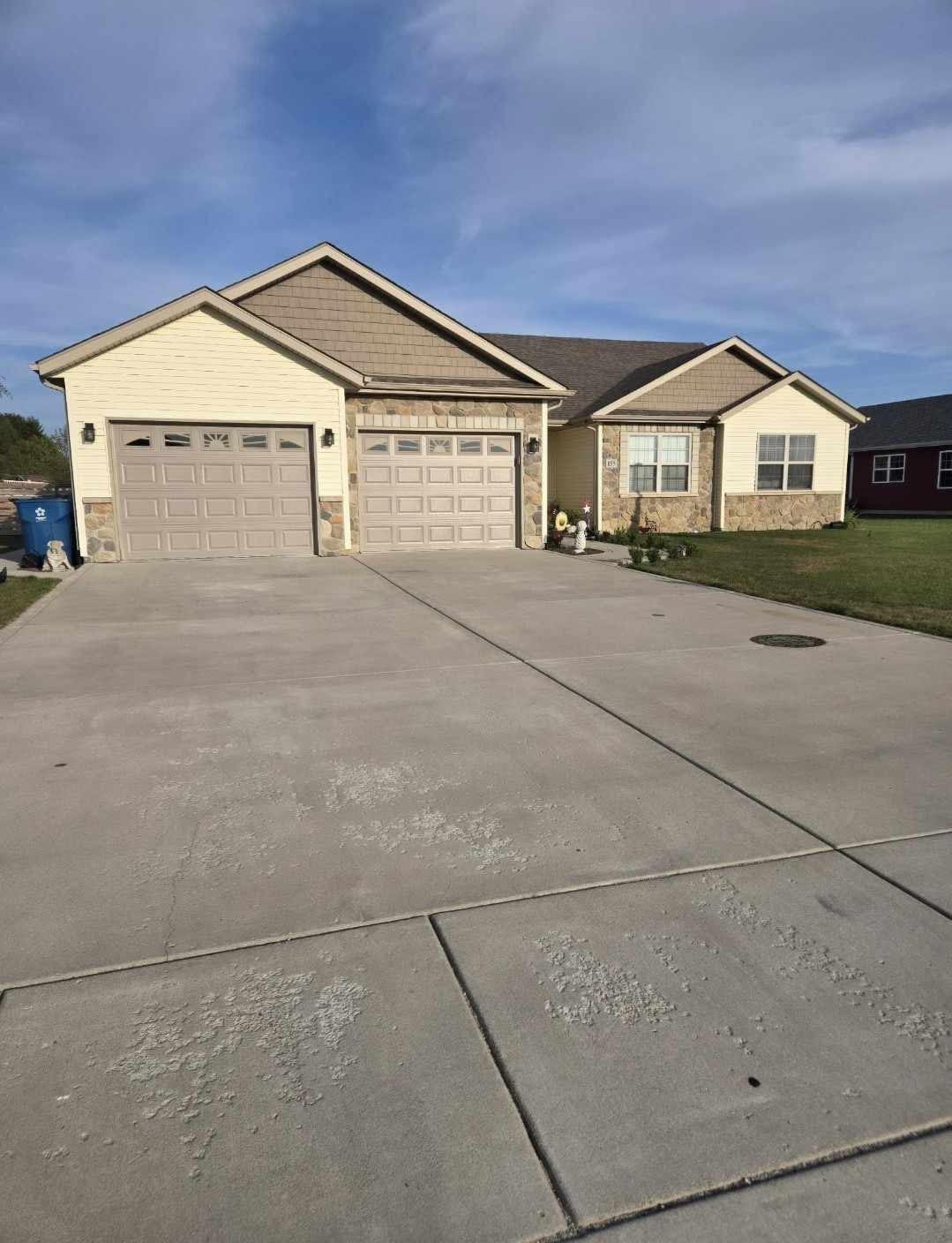 a view of house with garage and window