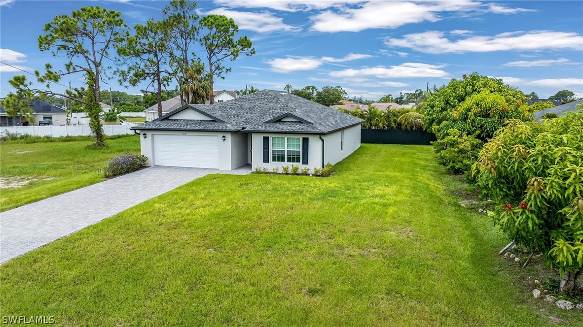 a view of a house with a yard