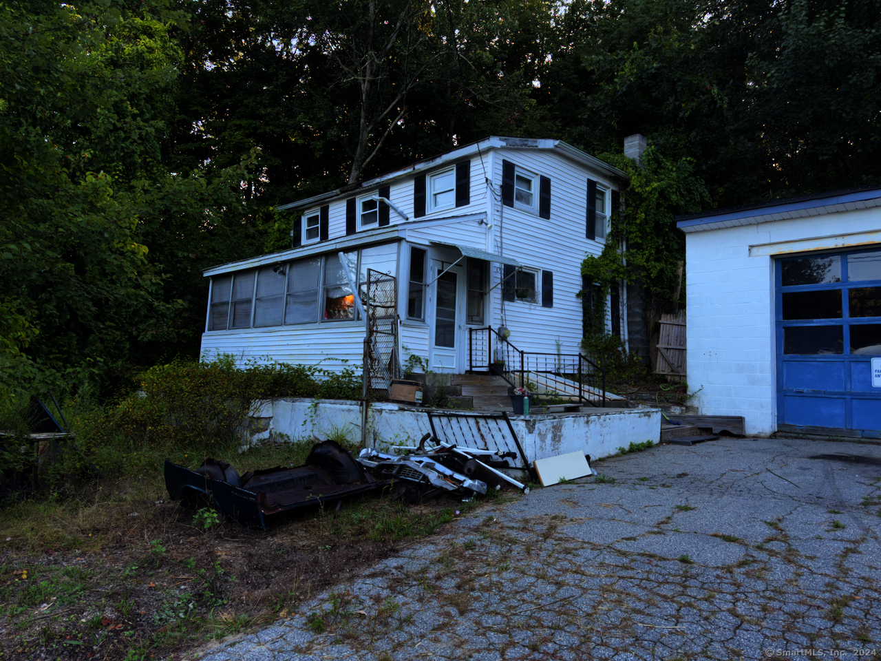 a front view of a house with table and chairs