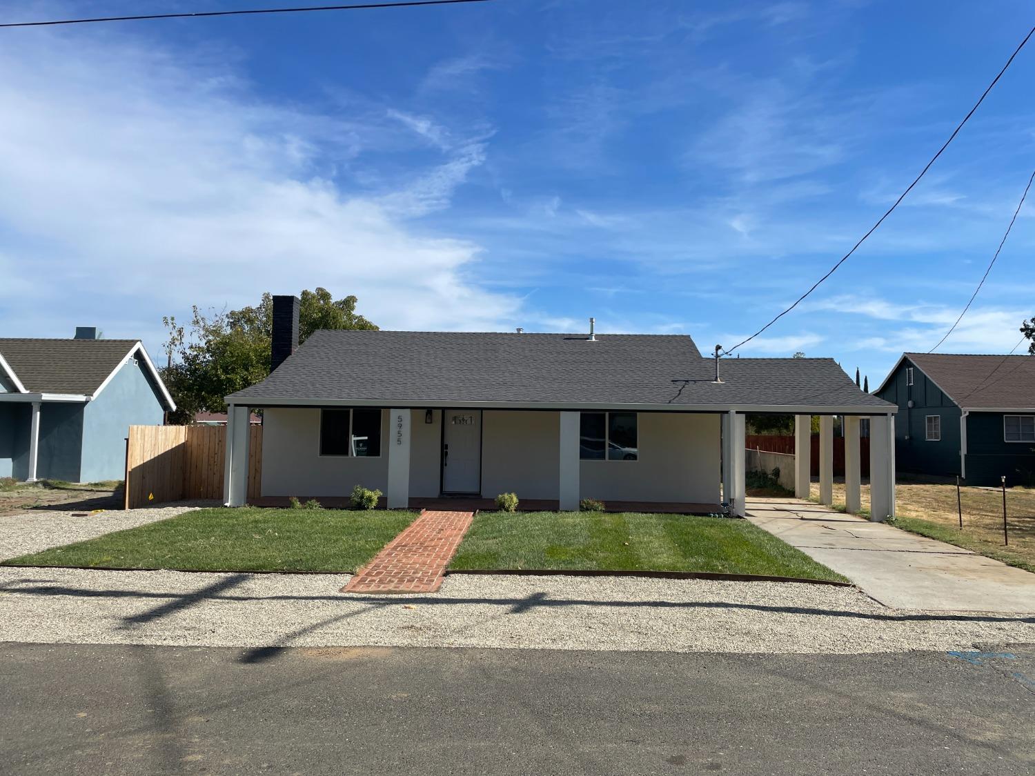 front view of a house with a small yard