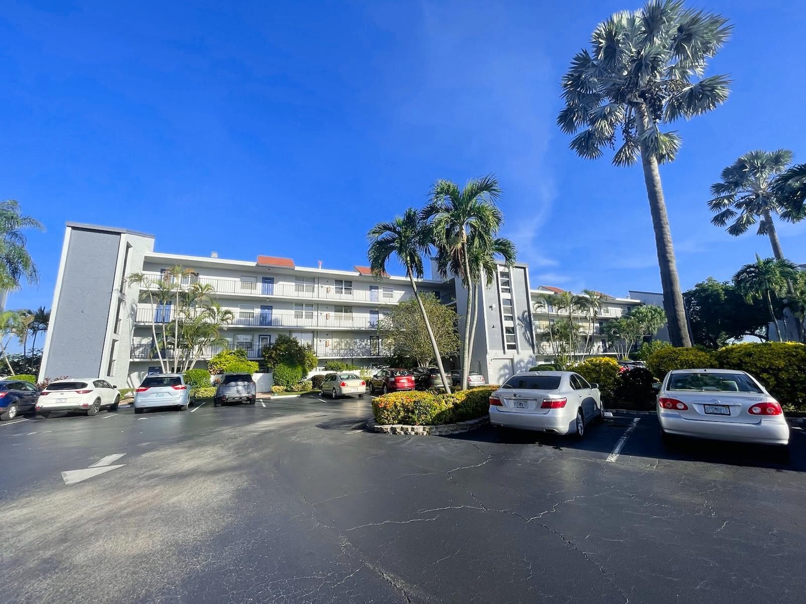 a view of cars parked in front of a building