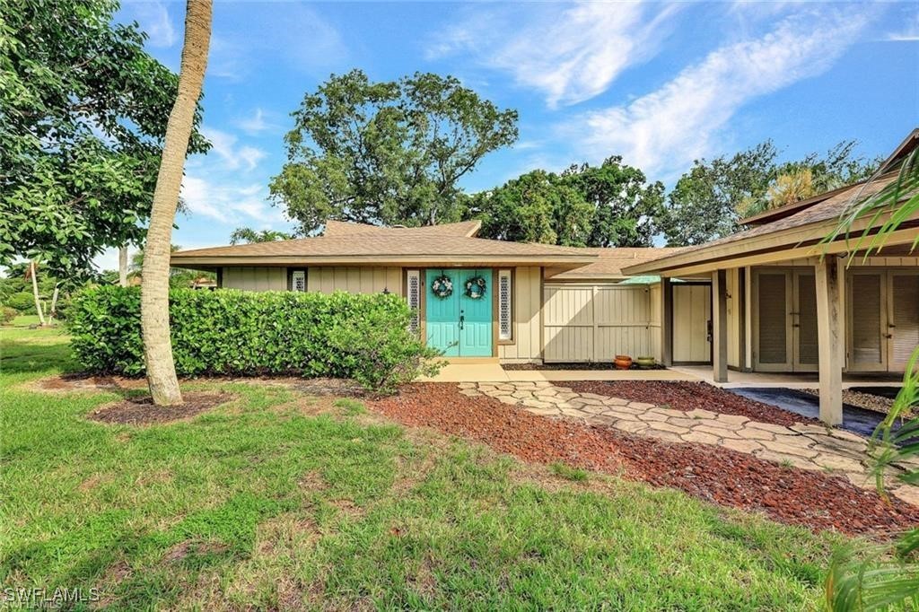 front view of a house with a yard