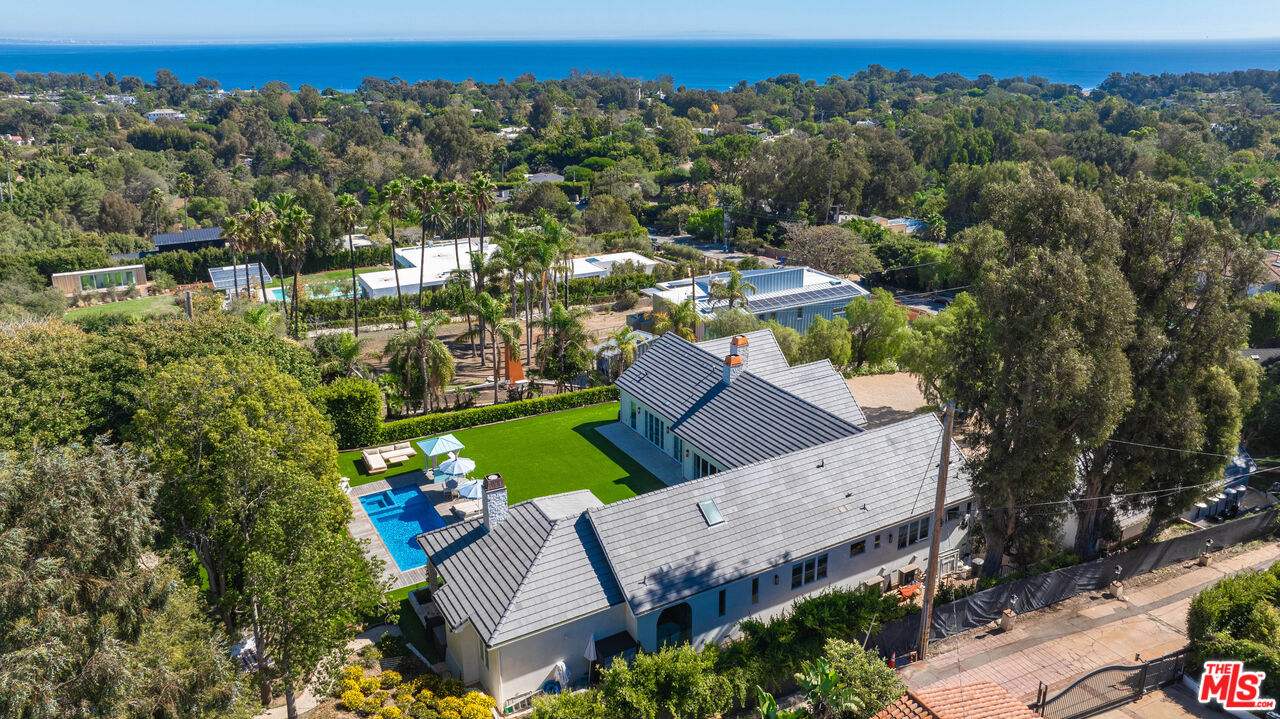 an aerial view of a house with a garden