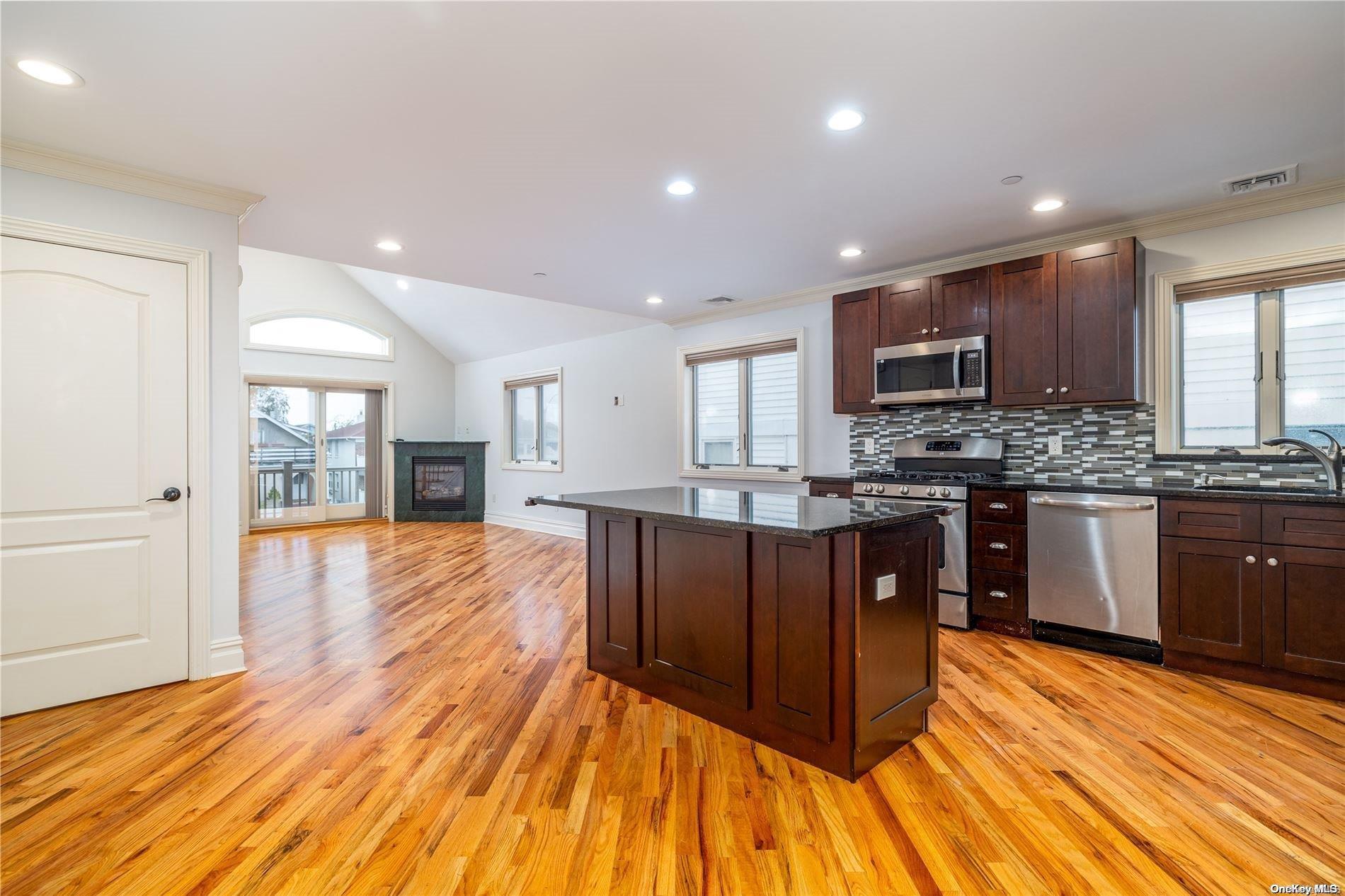 Open Kitchen to Living Room with Sliders to balcony