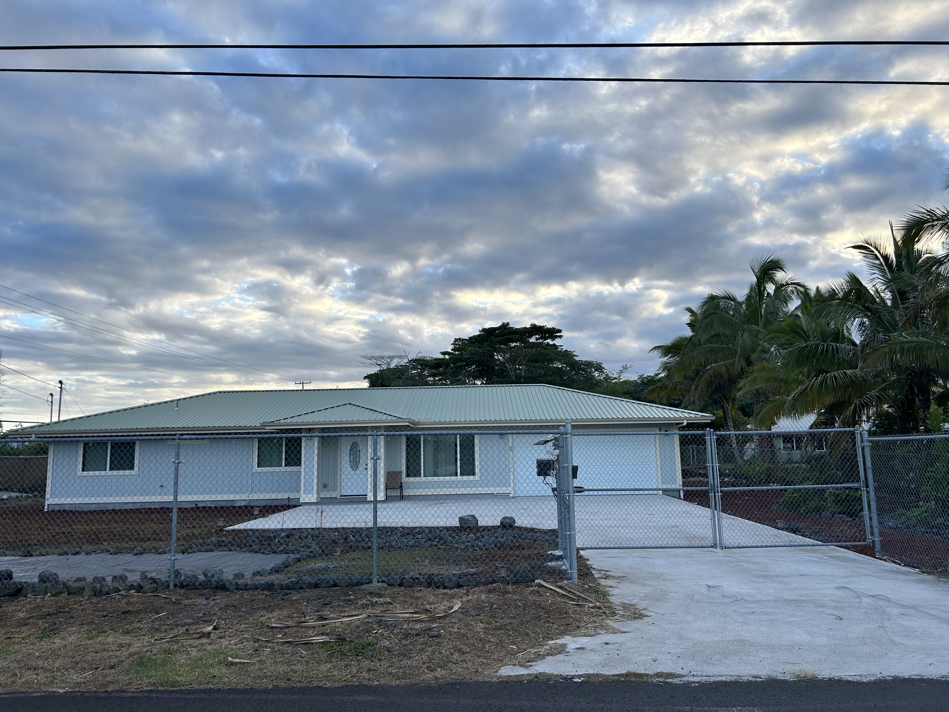 a view of a house with a street