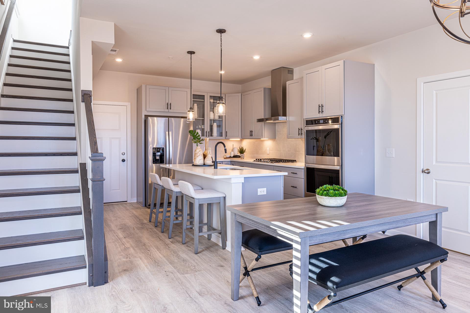 a kitchen with a table and chairs in it