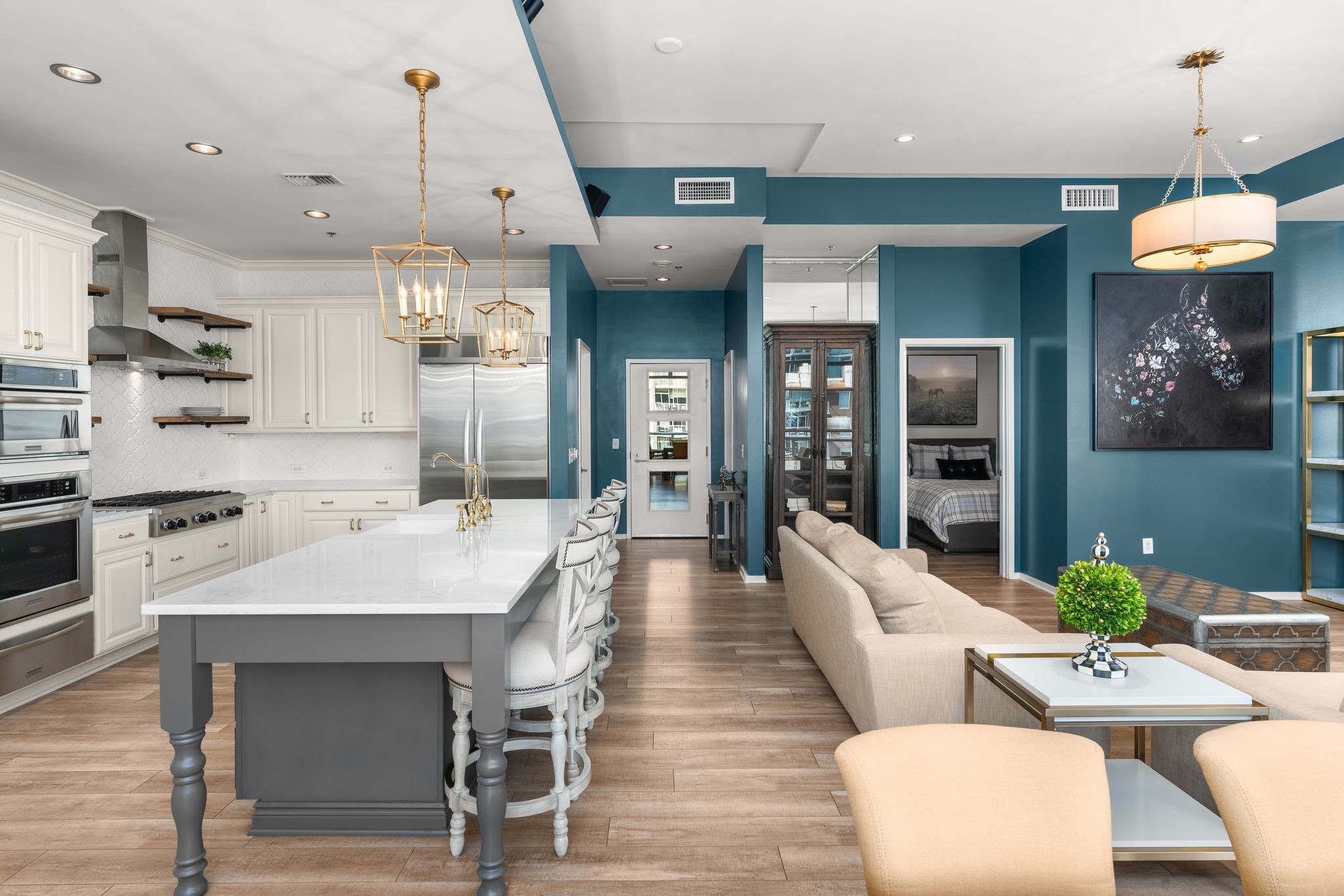 a large kitchen with a table and chairs